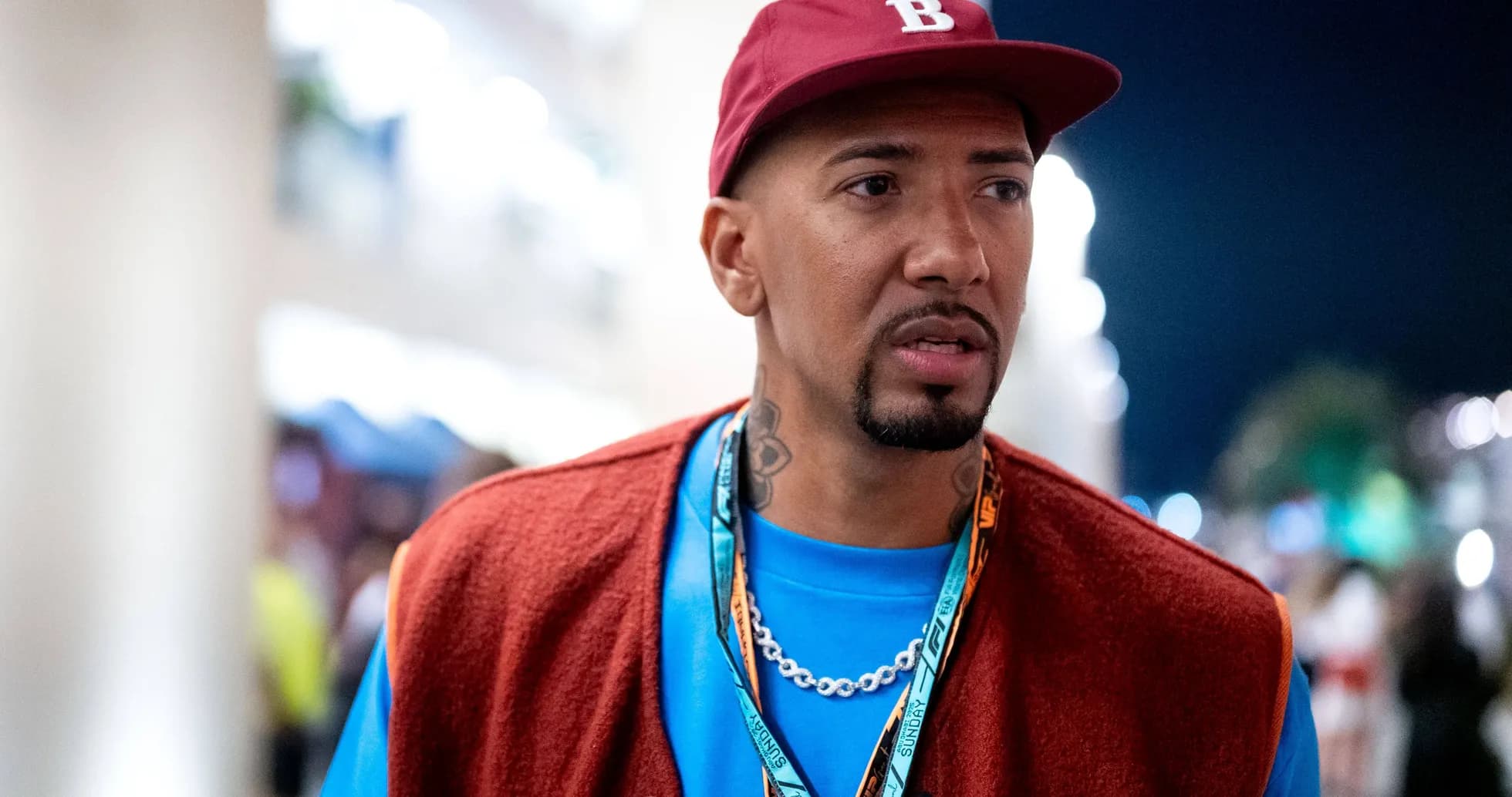 Person wearing a cap and colorful outfit outdoors