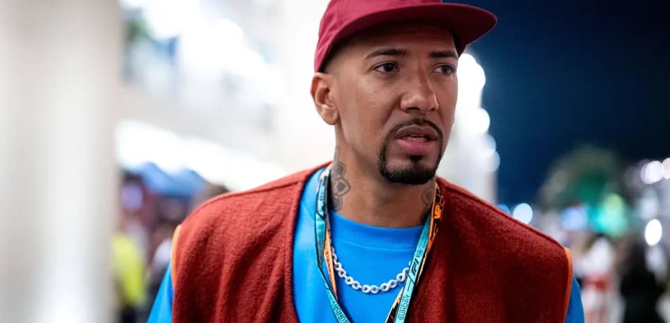 Person wearing a cap and colorful outfit outdoors