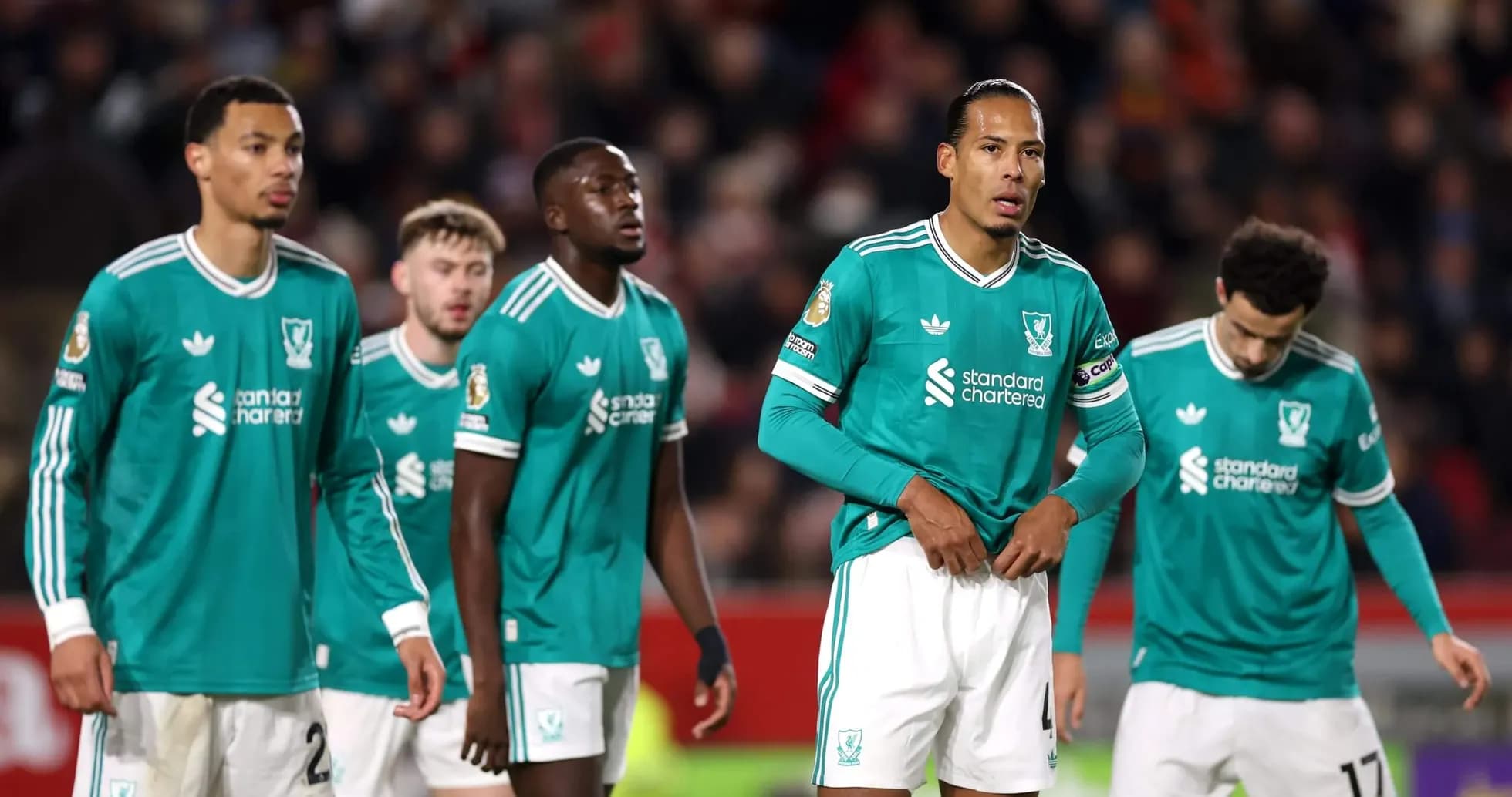 Joueurs de Liverpool en attente de la reprise du jeu