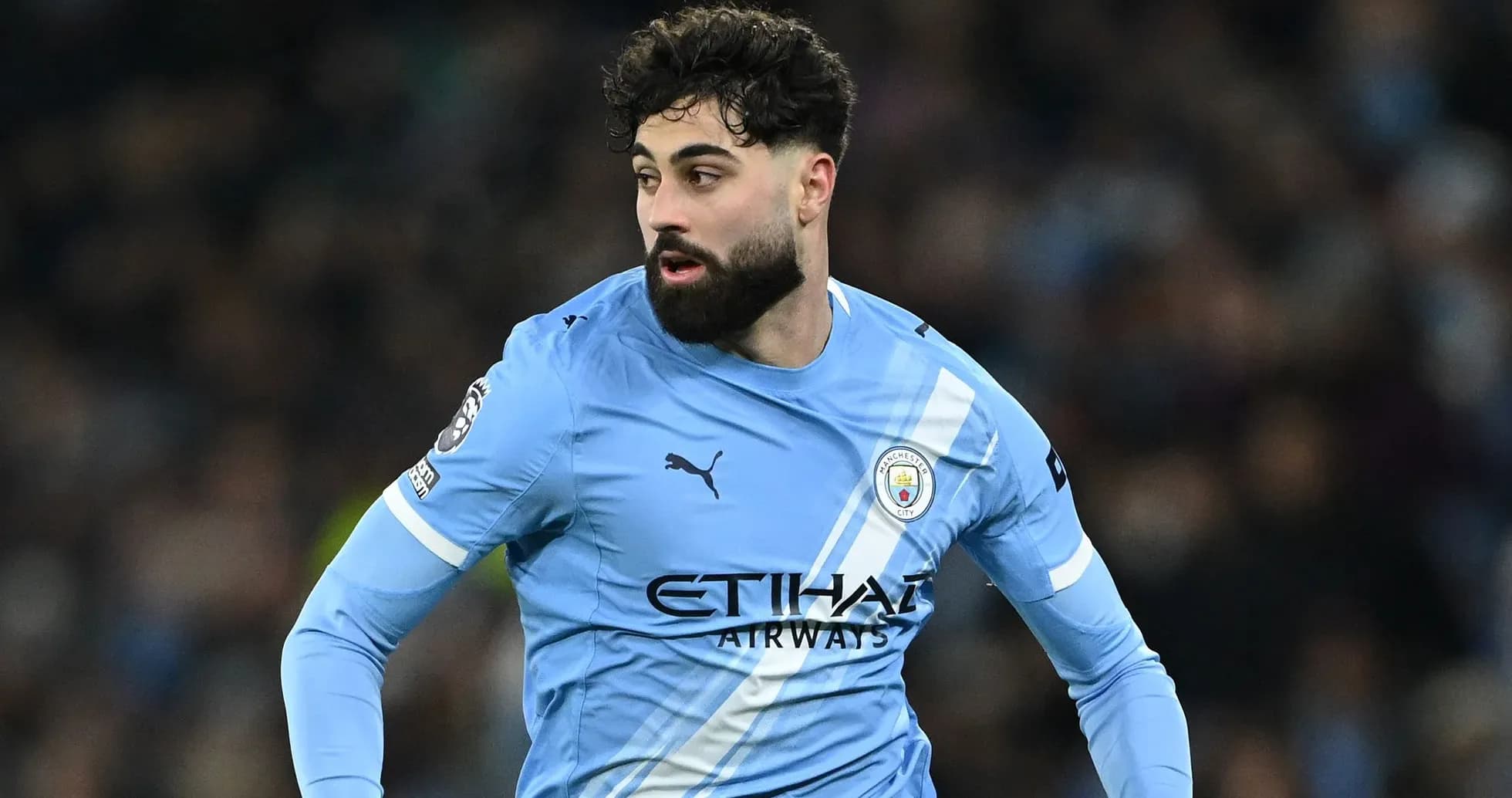 Joueur de Manchester City en action sur le terrain