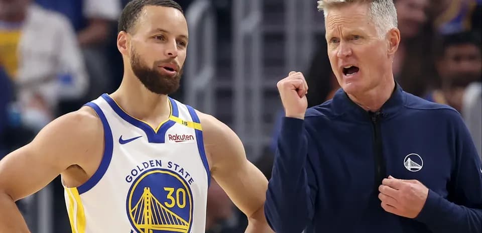 Stephen Curry and coach discussing strategy during game