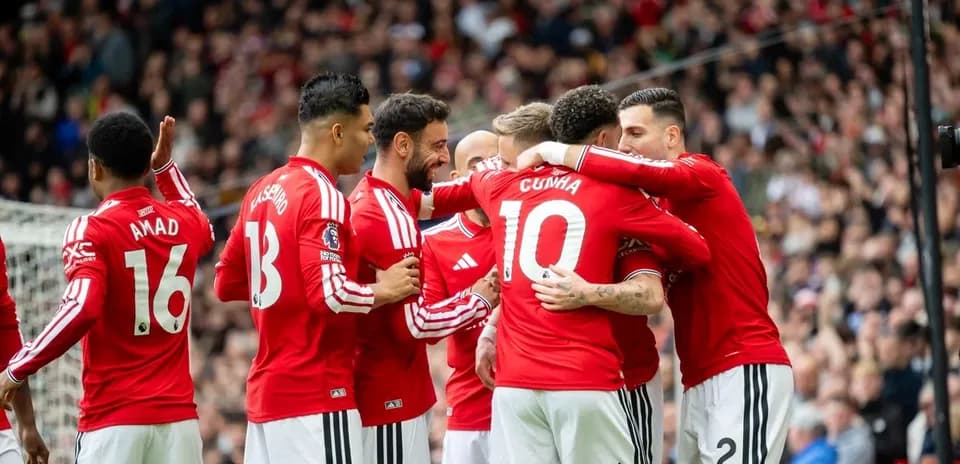 Joueurs de Manchester United célébrant un but