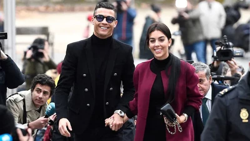Couple walking hand in hand at event