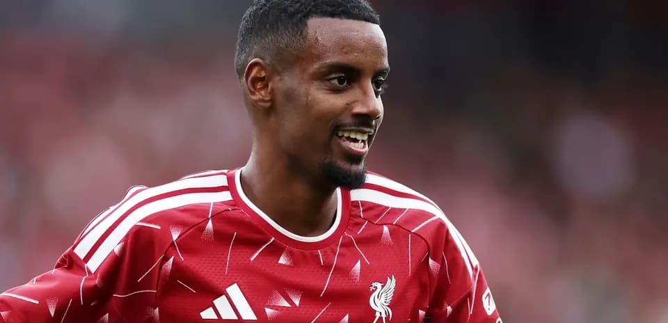 Joueur de Liverpool souriant pendant un entraînement