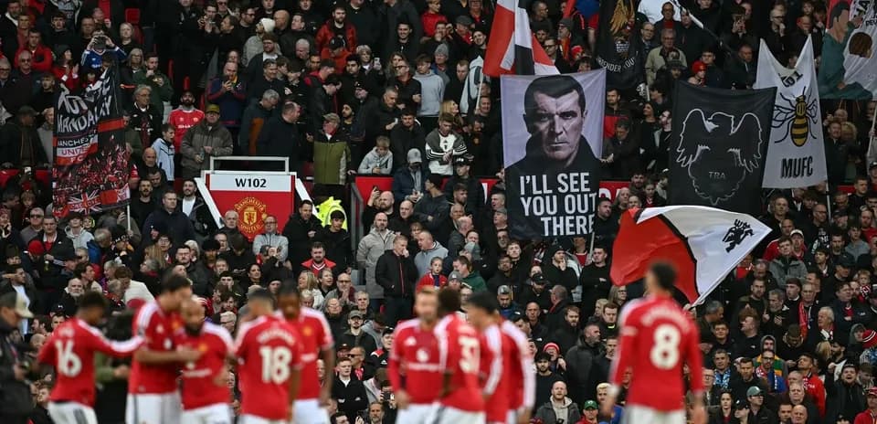Supporters with flags at Manchester United match