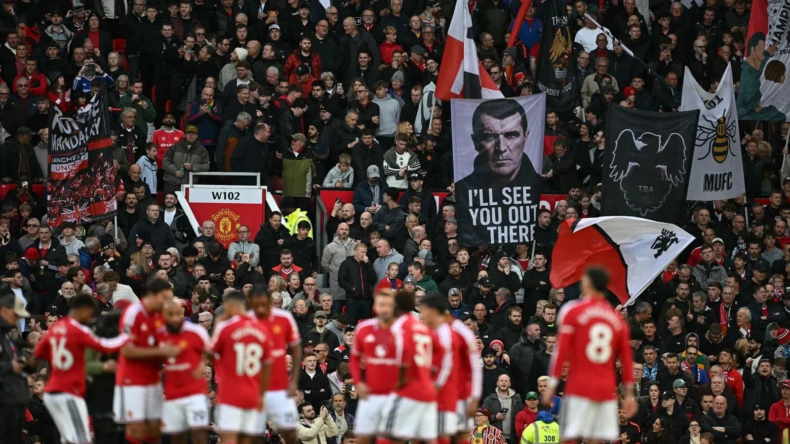 Supporters with flags at Manchester United match