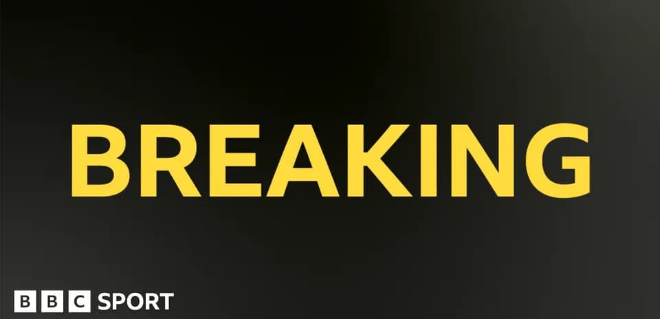 Texte 'BREAKING' en jaune sur fond noir