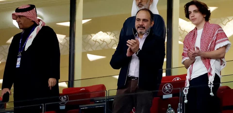 Spectators applauding in a stadium box