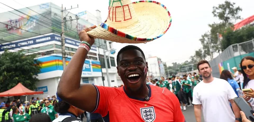 Supporter in England jersey wearing sombrero at event