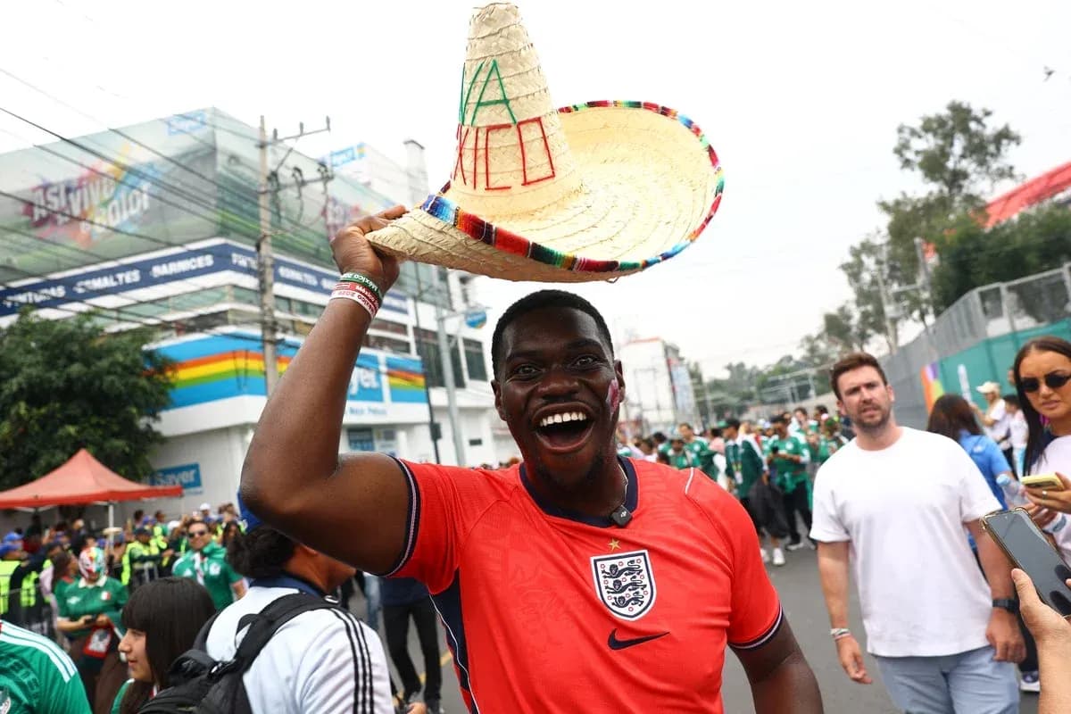 Supporter in England jersey wearing sombrero at event