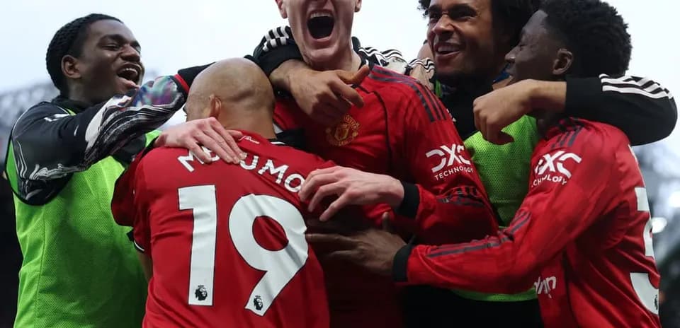 Joueurs de Manchester United célébrant un but