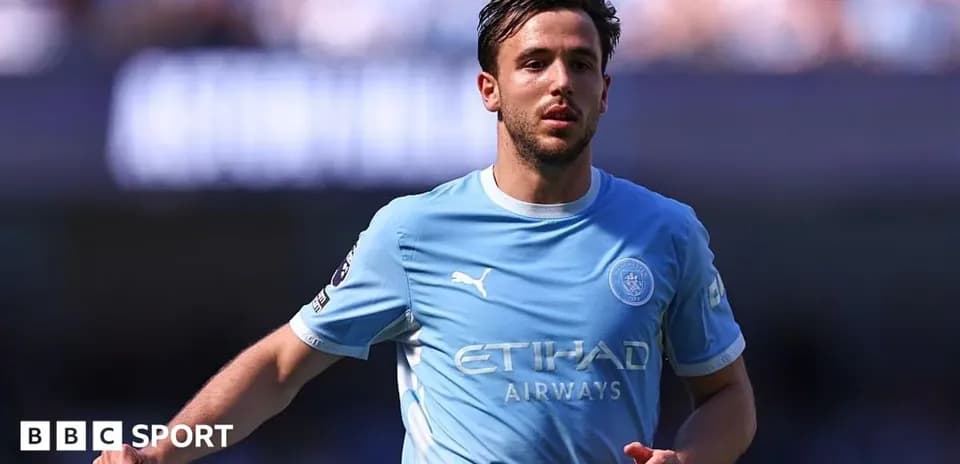 Joueur de Manchester City en action sur le terrain