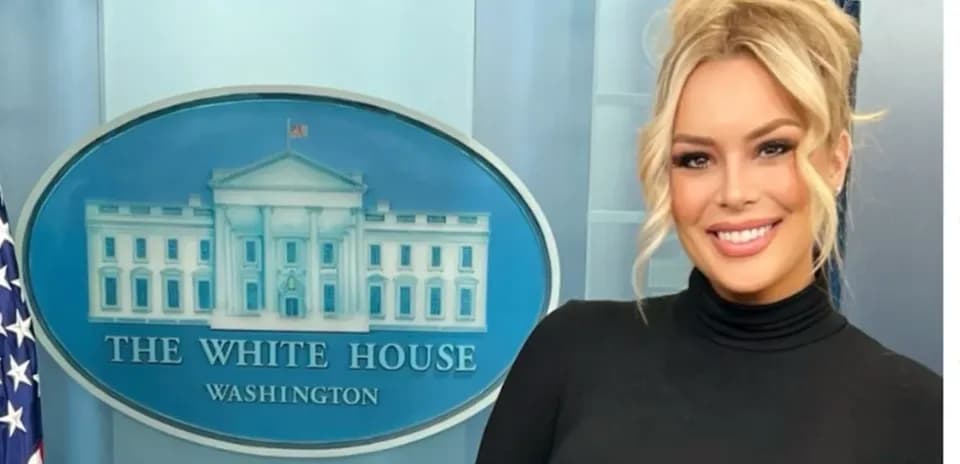 Person posing in front of The White House backdrop