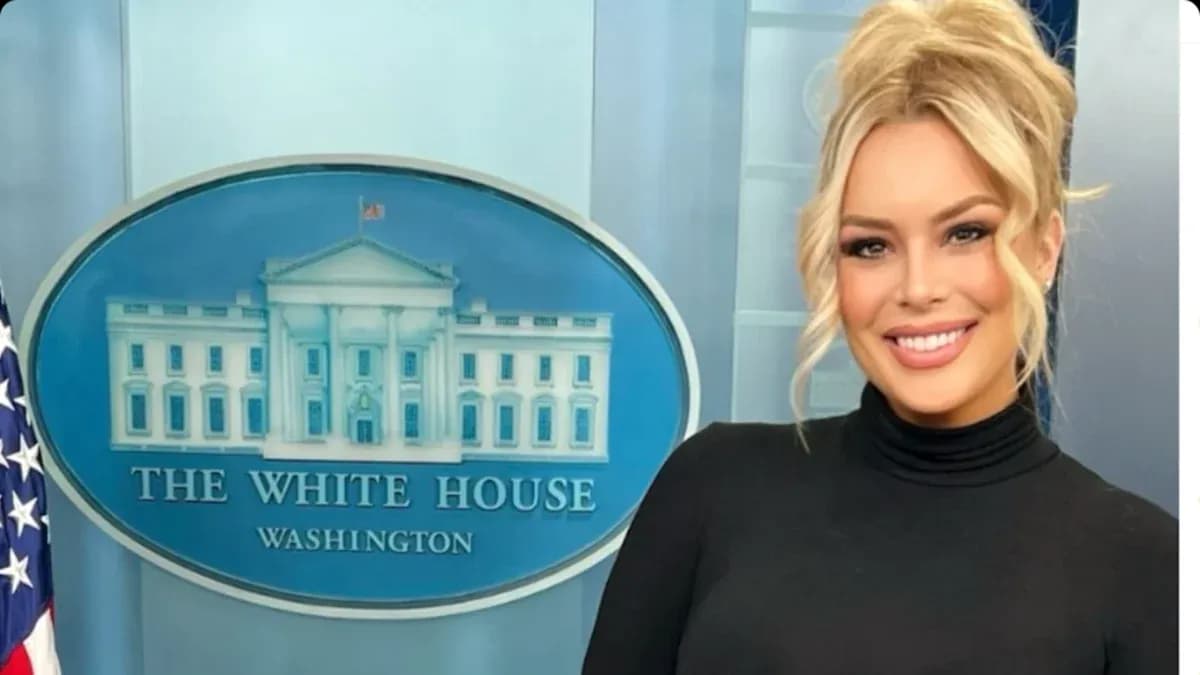 Person posing in front of The White House backdrop