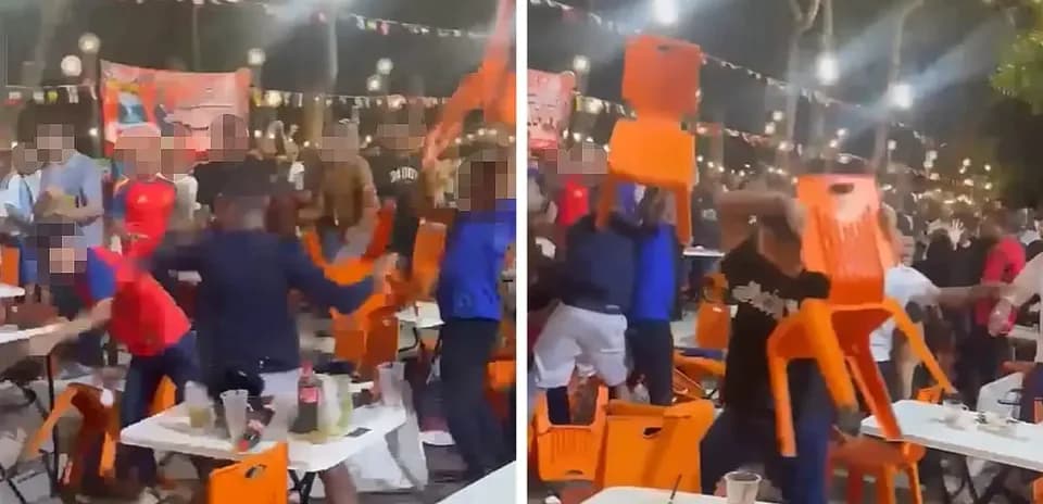 Supporters throwing chairs during a celebration event
