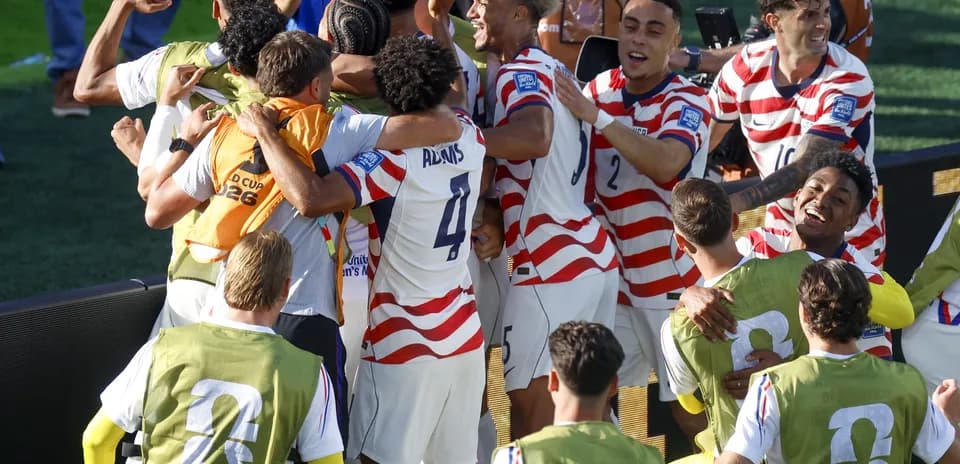 Joueurs américains célébrant un but au Mondial