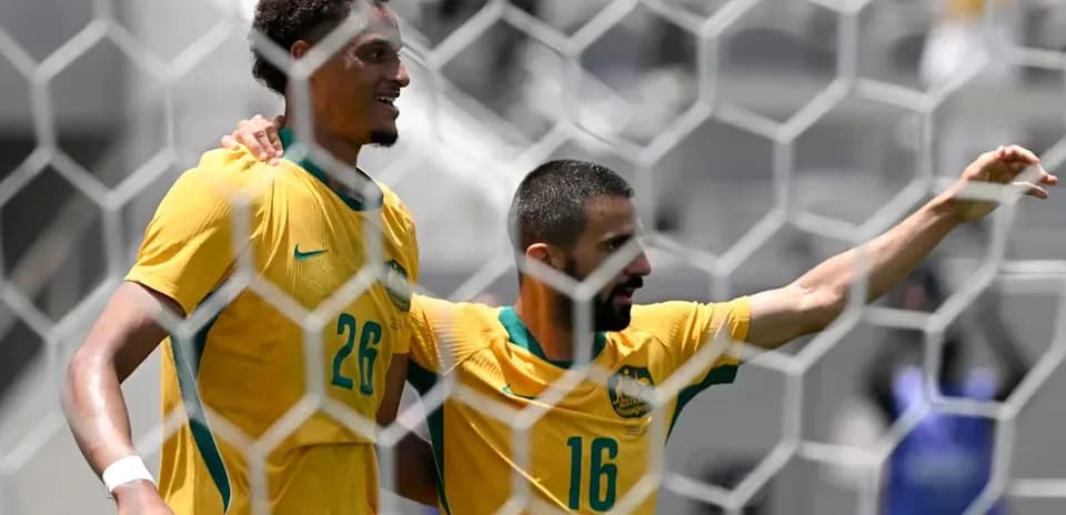 Joueurs australiens célébrant un but sur le terrain