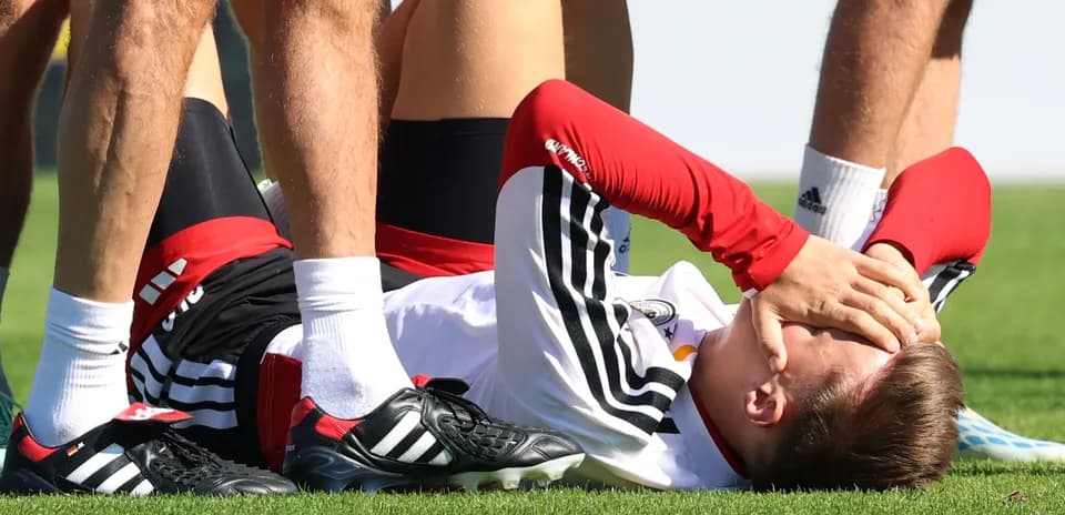Joueur blessé au sol lors d'un entraînement