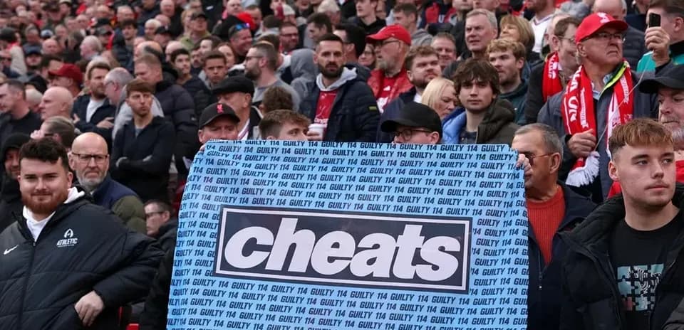 Supporters holding a banner with the word 'cheats'