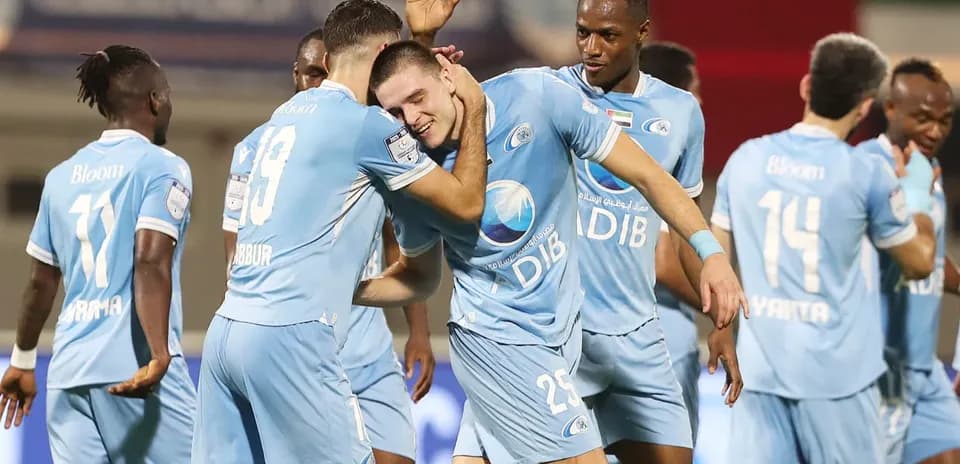 Joueurs célébrant un but lors du match