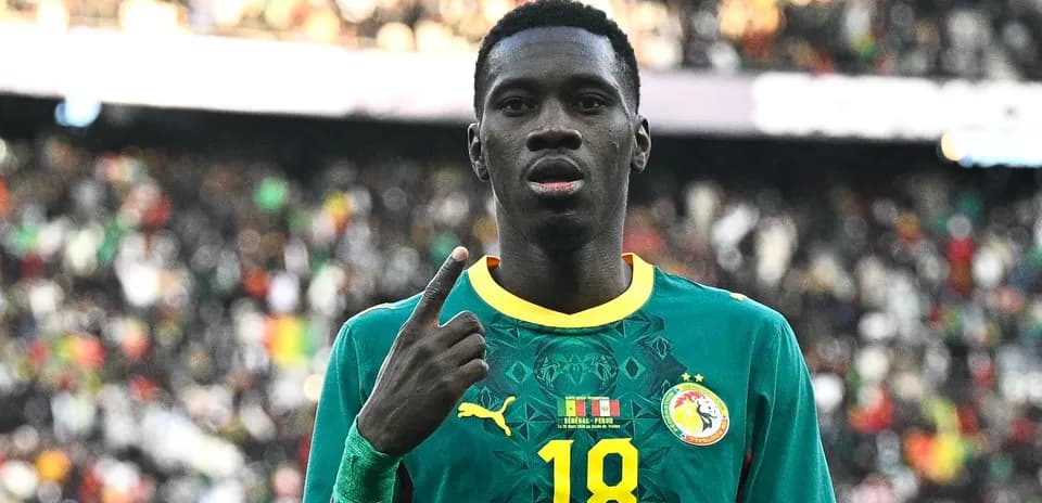 Joueur sénégalais célébrant avec le numéro 18