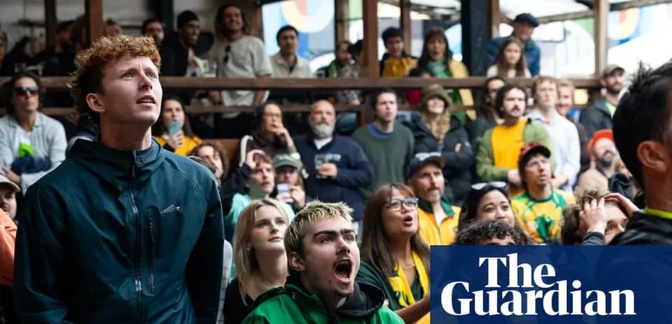Spectators watching a sports event with intense focus