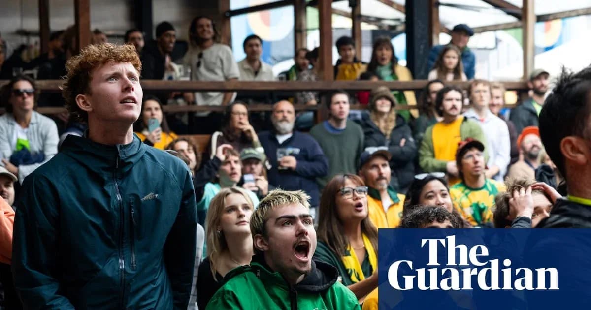 Spectators watching a sports event with intense focus