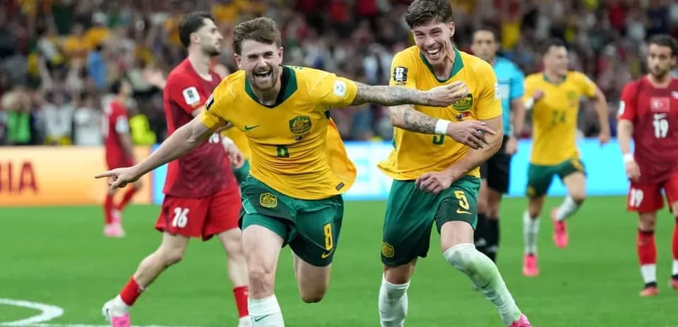 Joueurs australiens célébrant un but