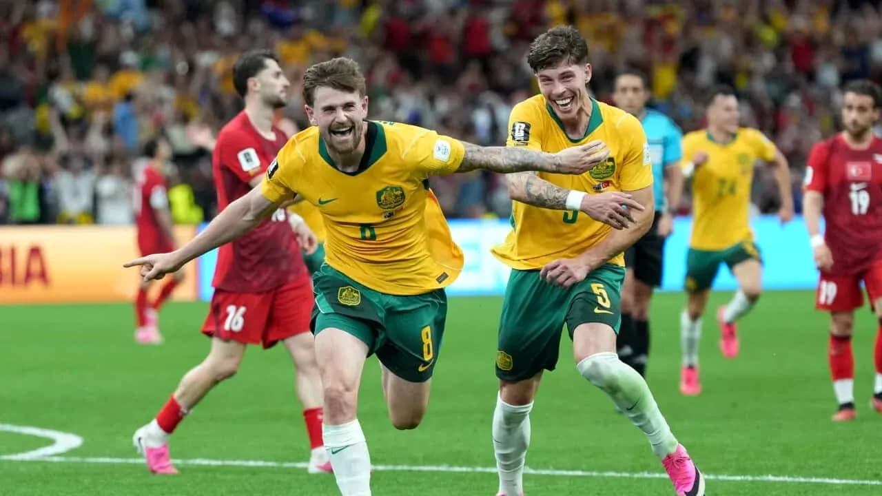 Joueurs australiens célébrant un but