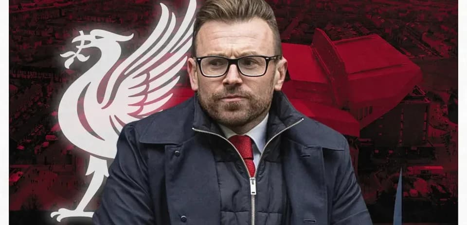 Person in front of Liverpool FC logo and stadium