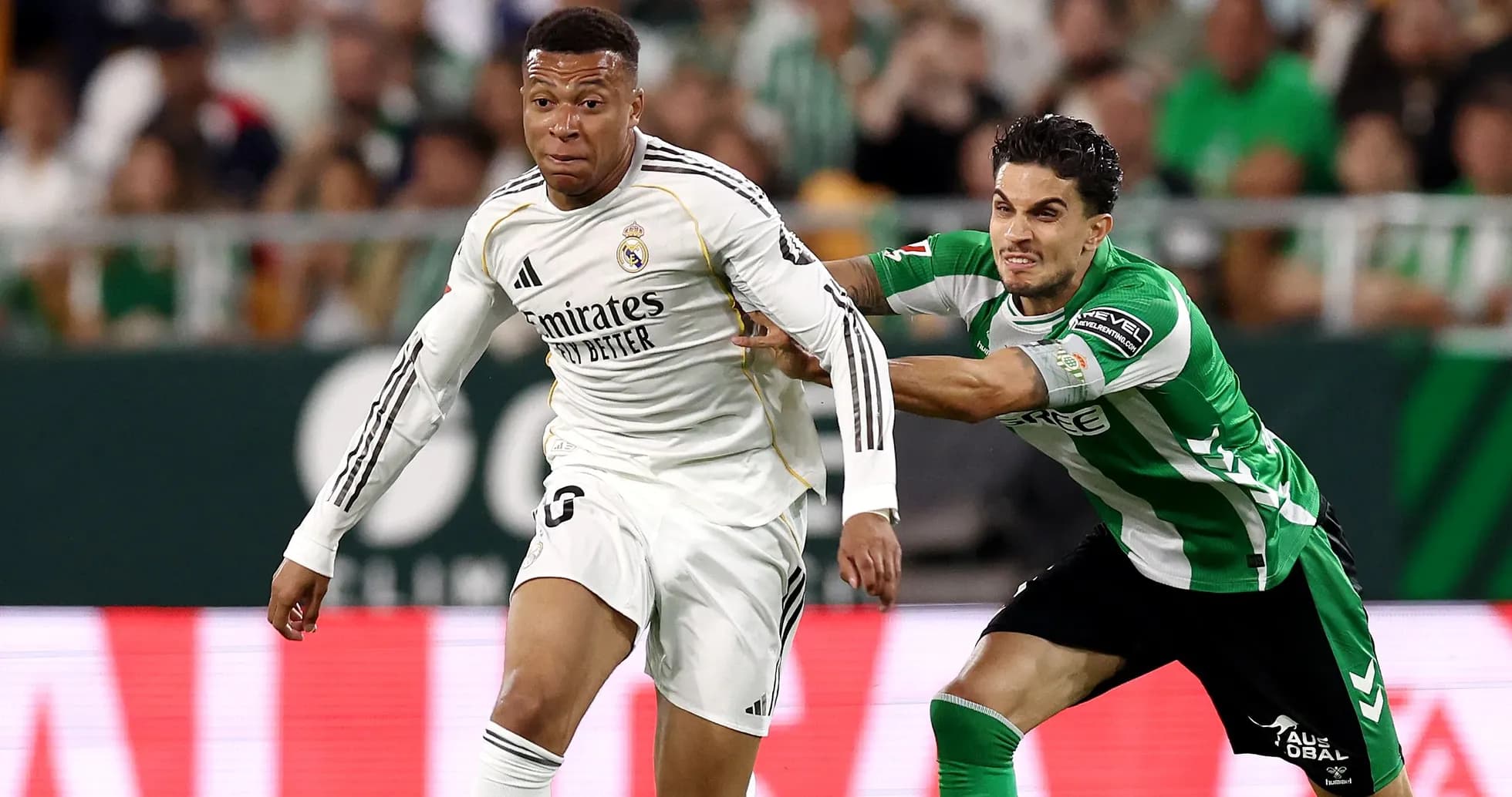 Mbappé dribbling past opponent during match