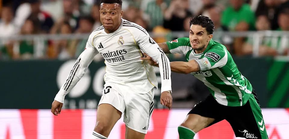 Mbappé dribbling past opponent during match