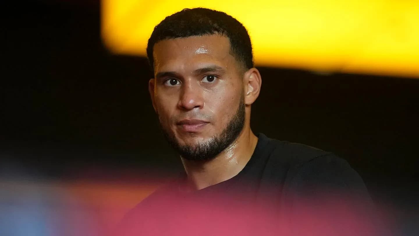 Athlete looking directly at the camera, sweating