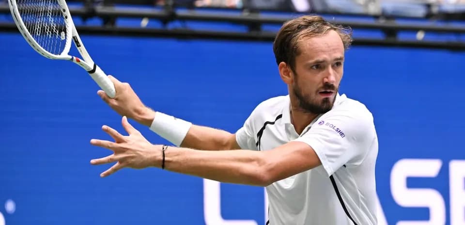 Daniil Medvedev hitting a backhand stroke during match