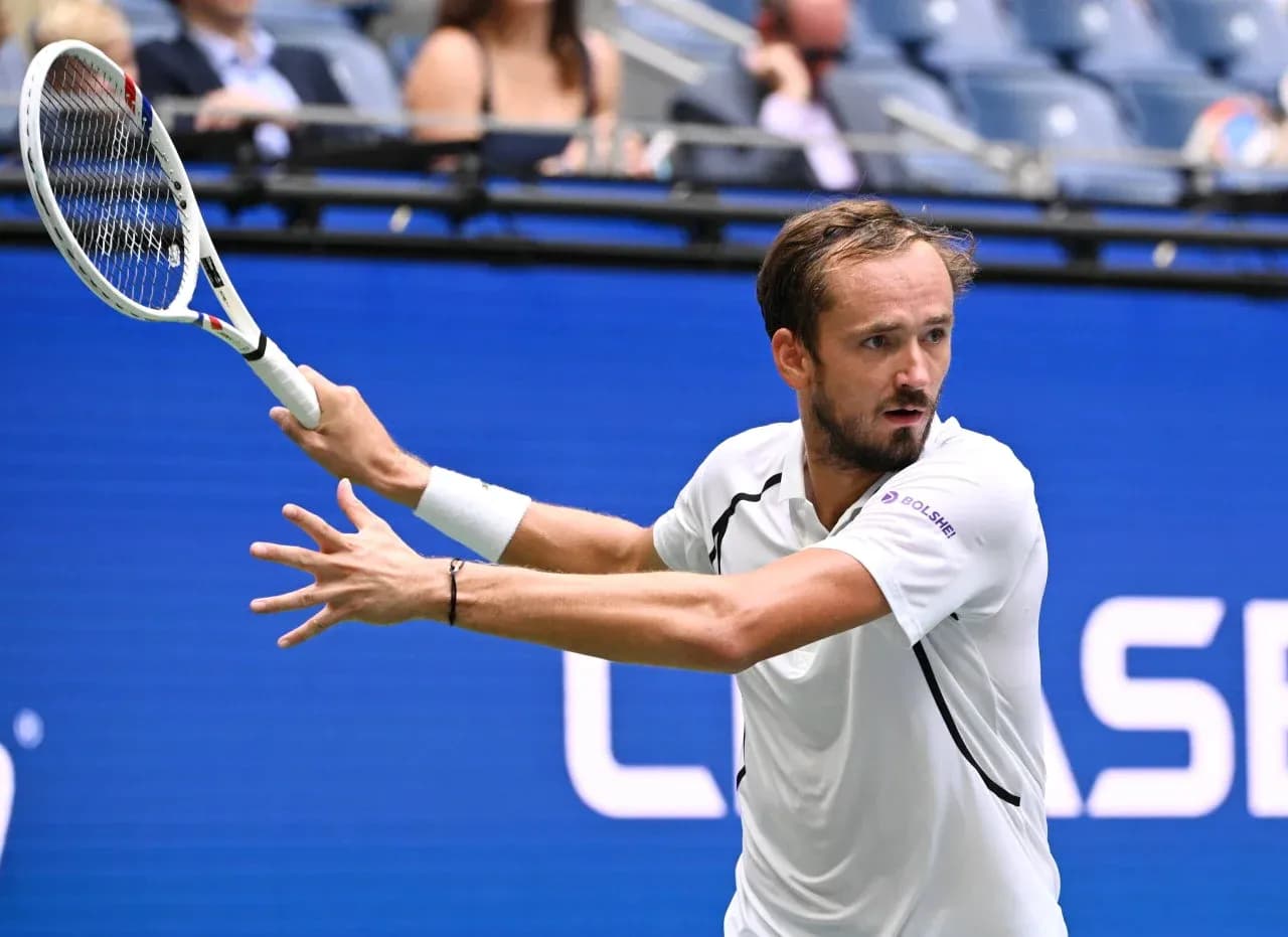 Daniil Medvedev hitting a backhand stroke during match
