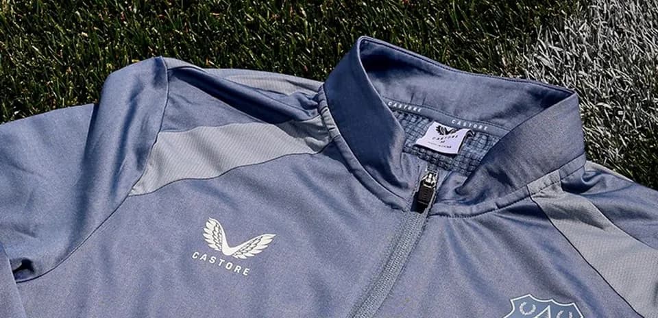 Veste grise avec logo d'Everton et Castore