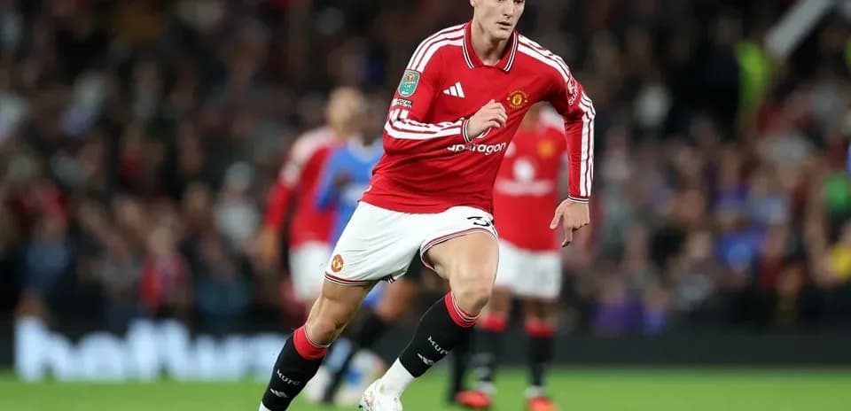 Joueur de Manchester United courant sur le terrain