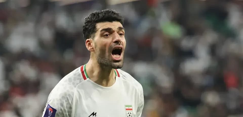Joueur iranien célébrant pendant le match