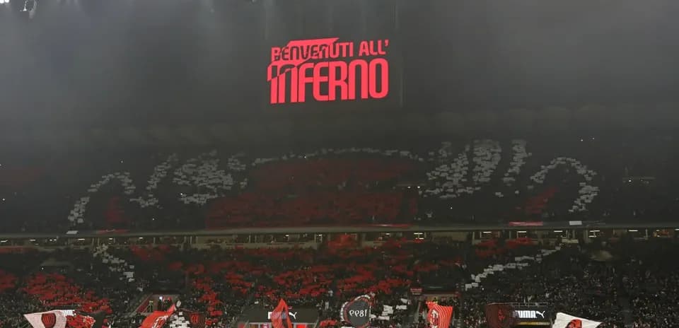 Supporters displaying banners in stadium during match
