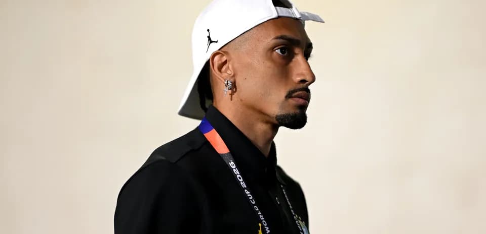 Person wearing cap and FIFA World Cup lanyard