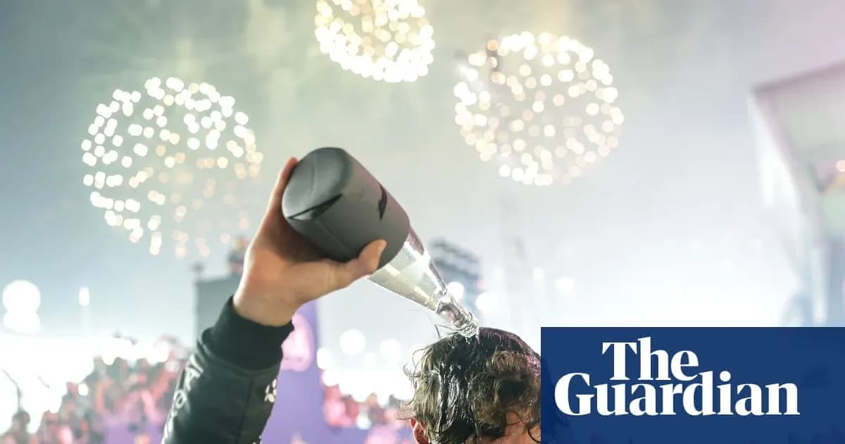 Person pouring champagne on their head with fireworks