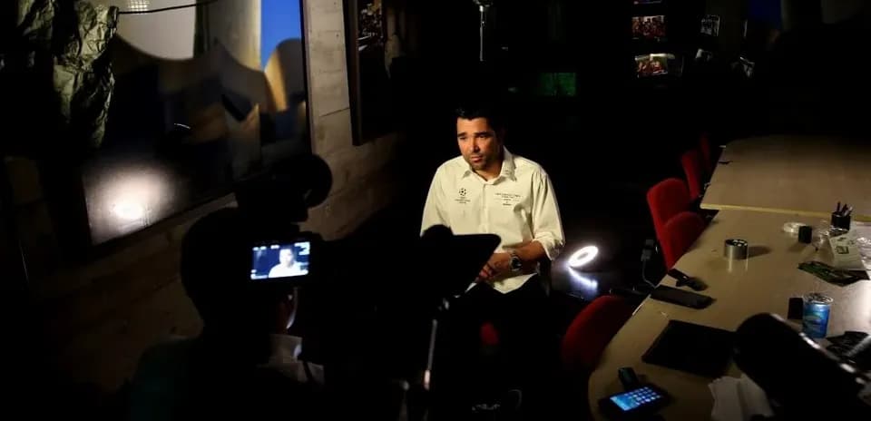 Interview setting with a man at a table