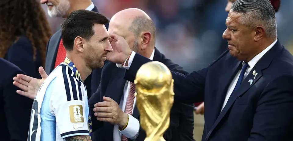 Lionel Messi receiving trophy after match presentation