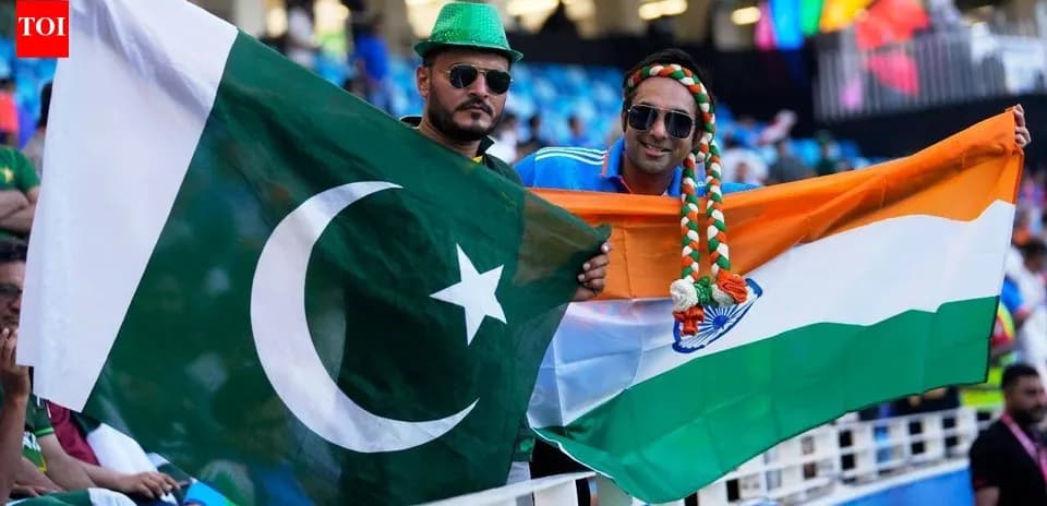 Supporters holding Pakistan and India flags at event
