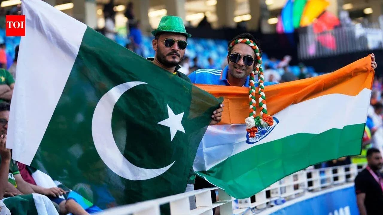 Supporters holding Pakistan and India flags at event