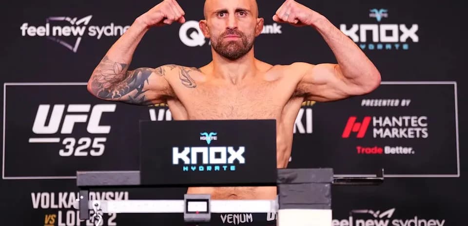Fighter flexing muscles at UFC weigh-in event