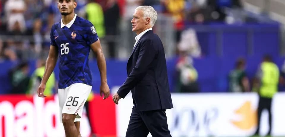 Didier Deschamps walking past player after match