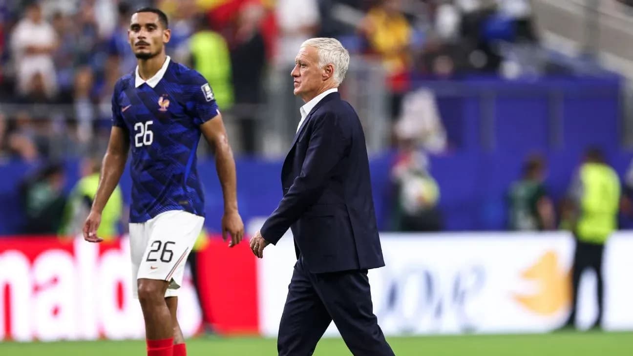 Didier Deschamps walking past player after match