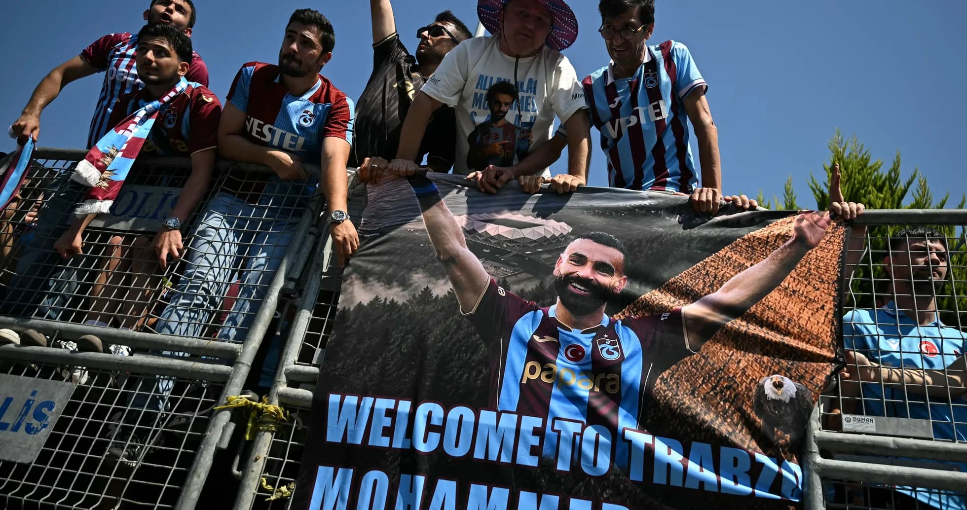 Supporters holding a banner welcoming Mohammed Salah