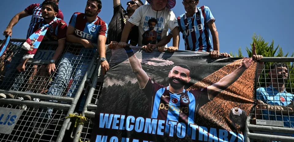 Supporters holding a banner welcoming Mohammed Salah